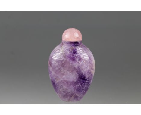 Chinese Carved Amethyst Snuff Bottle w/ pink quartz stopper.&nbsp;&nbsp;Height: 2.5 in.