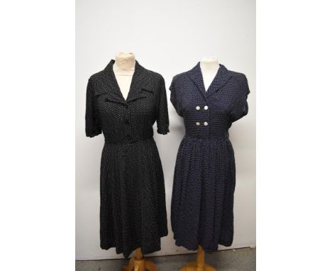 Two late 1940s/ early 1950s cotton day dresses, having white polka dot prints, one on blue ground and the other black, button