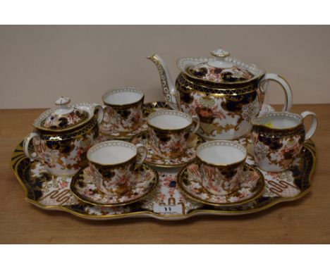 A Royal Crown Derby four setting tea set, comprising Four cups and saucers, teapot, sugar and milk, majority of pieces on 192