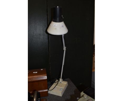 A vintage Anglepoise style desk lamp.