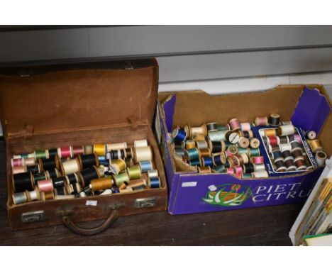 A large collection of predominantly vintage spools of thread.