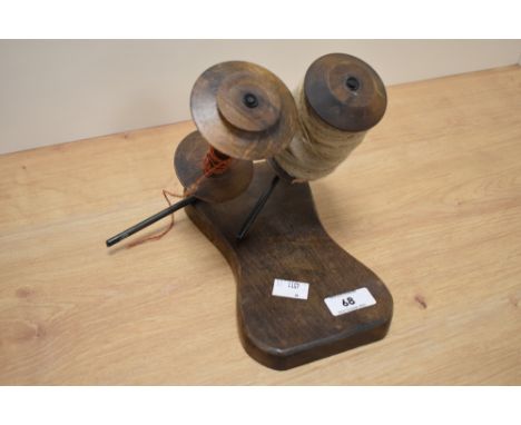 A vintage treen weavers bobbin holder
