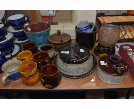 A mixed lot of vintage studio pottery, includingmugs, cheese dome, planter etc, various styles and colours.
