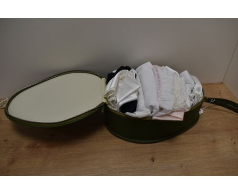 A selection of vintage and retro slips and undergarments and a nightdress case in original packaging.