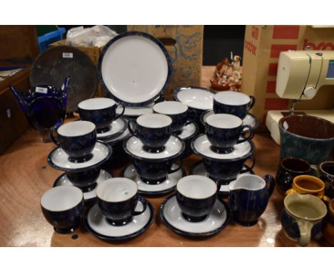 A collection of Denby table ware, having Art Nouveau styling, including plates, cups and saucers bowls and jug.