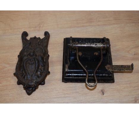 A vintage cast door knocker and a hole punch, stamped Shannon