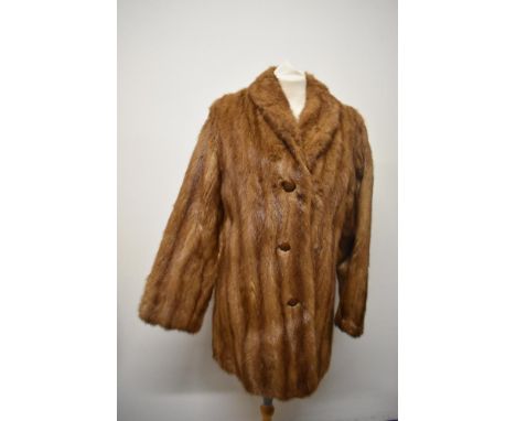 A vintage mid century caramel coloured mink coat.