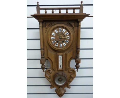 A French compendium wall clock in galleried carved and turned case, inset with thermometer and dial barometer, the dial with 