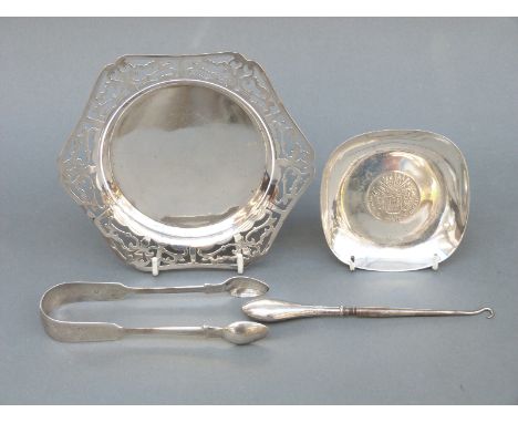 A pair of 19thC hallmarked silver sugar tongs and a coin-based tray marked 925, weight of both 110g, together with a silver-h