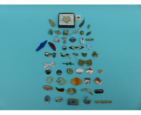 A collection of brooches including glass, enamel, paste, marquesite, ceramic, Channel Island example, many in bow designs
