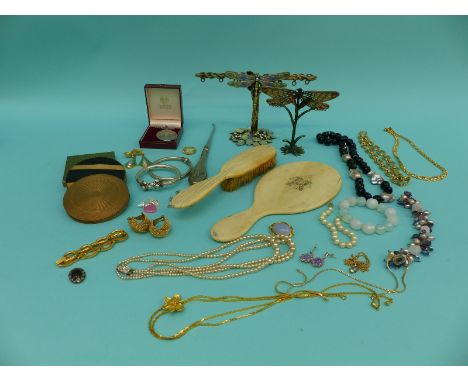 A collection of jewellery including silver bangles, French jet and pearl necklace, three compacts, two Art Nouveau style jewe