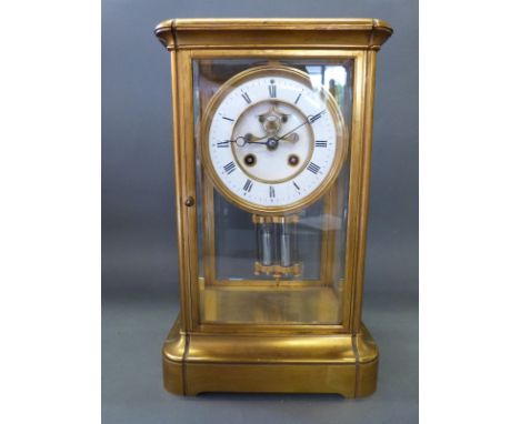A four glass late 19thC brass mantel clock, the two-train movement by F. Martis, Paris, numbered 3574, with mercury compensat