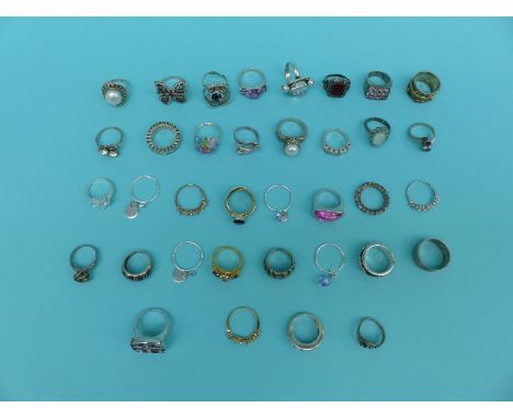 A collection of 37 silver/white metal rings including pearl, topaz, crystal etc