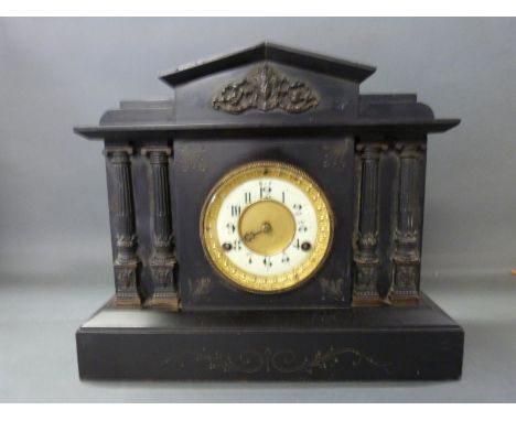 A late 19thC black slate mantel clock in classical architecture style with reeded Roman columns with acanthus leaf decoration