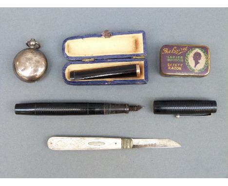 A hallmarked silver sovereign holder, mother of pearl silver bladed fruit knife, Blackbird Mabie Todd pen with 14ct gold nib,