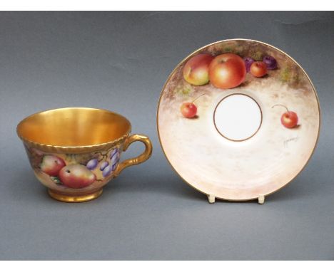 Royal Worcester painted fruit cup and saucer with gilt interior, the cup signed Chapman and the saucer F Higgins