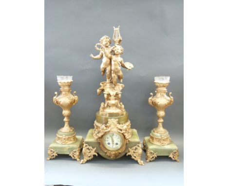 A large 19thC French onyx and gilt ormolu mantel clock garniture, the case decorated with putti and cherubs, the two train mo