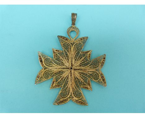 A silver gilt large filigree pendant in the form of a Maltese cross with blue and white enamel armorial crest to the centre, 