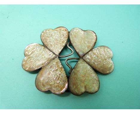A silver buckle set with six panels of mother of pearl in the form of a clover/ shamrock 