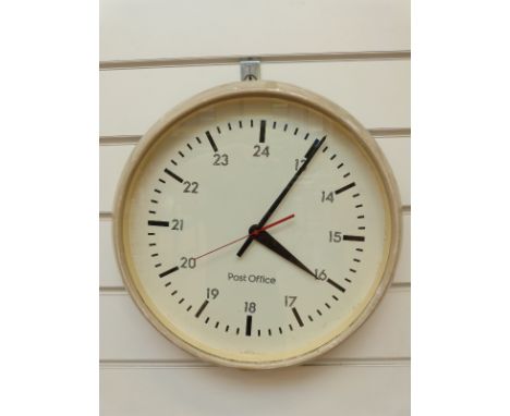 A c1970s Post Office dial wall clock with baton numerals and Arabic 24 hour, baton hands on white dial with red seconds sweep