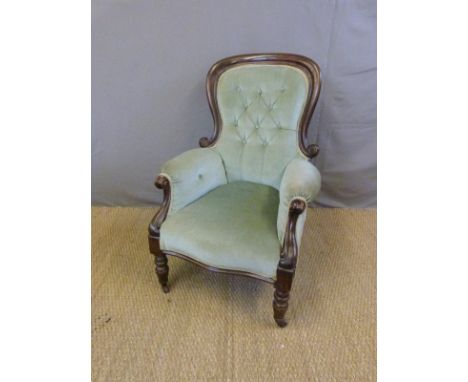 A 19thC mahogany-framed button-back armchair