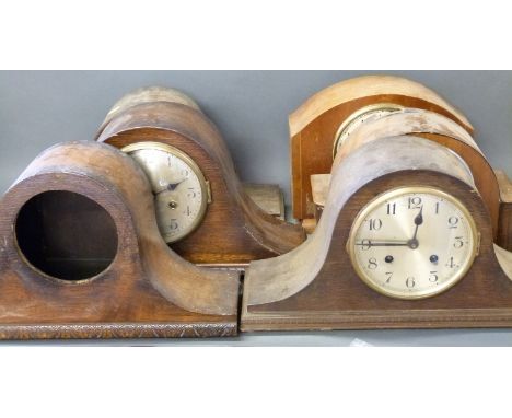 Four largely Napoleon hat style mantel clocks for the restorer with Arabic numerals and two train movements, together with tw