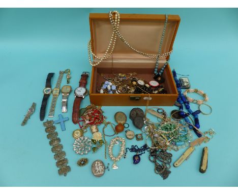 A collection of costume jewellery including brooches, watches, silver cameo ring, compass charm silver ring, silver cameo bro