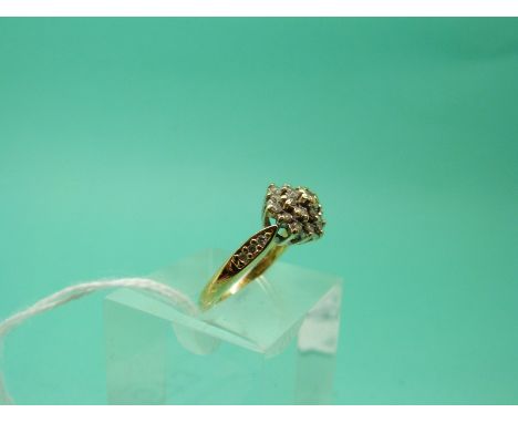 An 18ct gold ring set with diamonds in a cluster (Size K), weight 3.63g