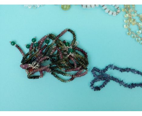 A collection of necklaces including moonstone, aquamarine and pearl, moonstone and amethyst set in silver gilt, lemon quartz 