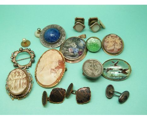 A collection of jewellery to include two white metal pendants/ brooches set with cameos, Japanese cufflinks, Victorian silver