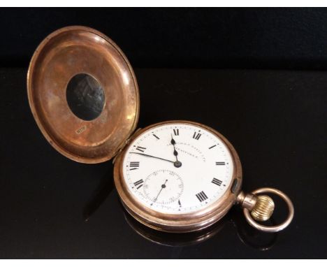 Ashford & Davis Ltd of Stratford East 9ct gold half hunter keyless winding pocket watch with Roman numerals, subsidiary secon