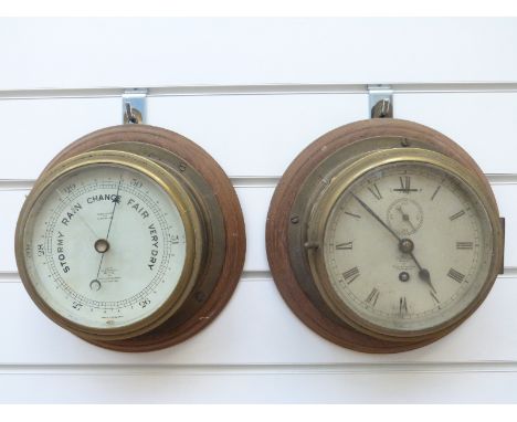 A brass cased Short & Mason ship's bulkhead clock with Roman dial and matching barometer, diameter 20cm