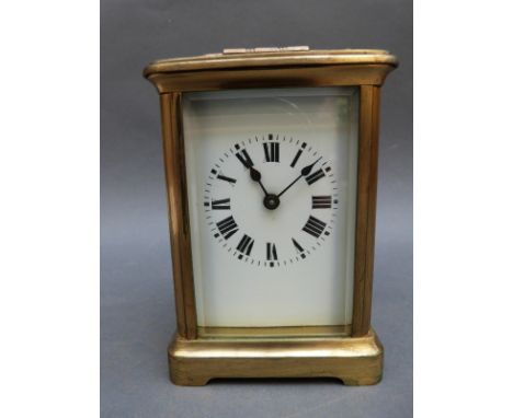 Brass corniche style French carriage clock with enamelled dial with bold Roman numerals with inscription to top dated 1915, 1