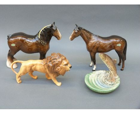 Four items of Beswick including Shire horse, lion and a trout dish