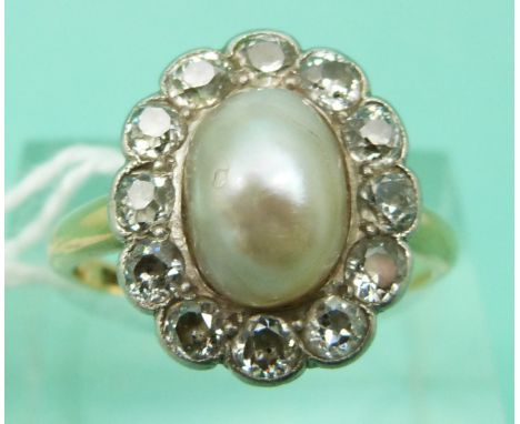 An 18ct gold Victorian ring set with a large natural saltwater pearl surrounded by old cut diamonds each approximately 0.1ct 