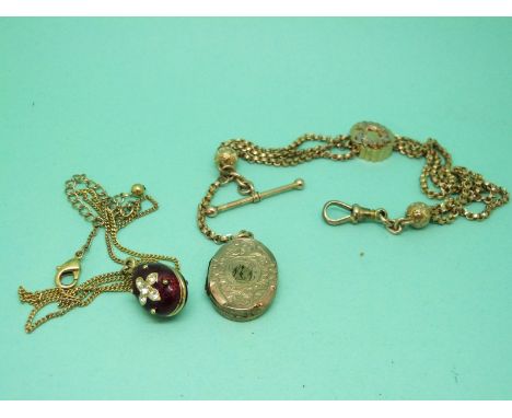 A Victorian gold plated ladies fob chain with plated locket and an enamel egg pendant