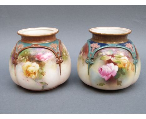 A near pair of Hadley's Worcester squat lobed vases decorated with roses, one marked Hadley's, the other Royal Worcester, sha