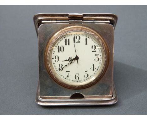A George V hallmarked silver travelling clock with Swiss movement, Chester 1913 maker's mark rubbed, width 6.5cm