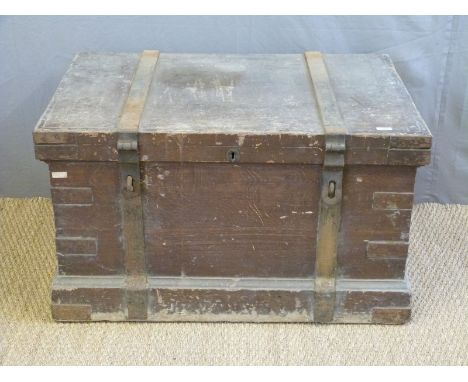 A 19thC metal bound stained pine silver chest/trunk with metal looped handles, the interior with velvet lined three layer mul