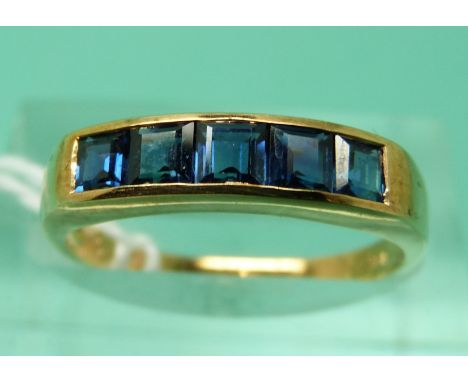 A 14ct gold ring set with 5 square step cut sapphires (size M/N)