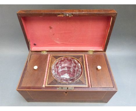 A 19thC crossbanded and inlaid mahogany tea caddy with mixing bowl flanked by tea compartments, width 30cm