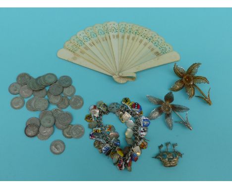Silver and enamel charm bracelet, filigree brooches, fan, silver coinage etc