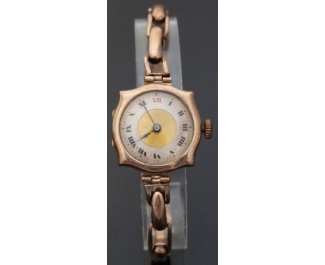 9ct gold ladies wristwatch with Roman numerals, gold engine turned face, blued hands and shaped case, on expanding bracelet, 