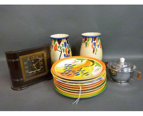 A collection of Wedgwood Clarice Cliff plates, Art Deco Crown Ducal vases and an Art Deco bakelite clock