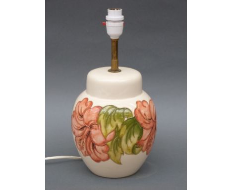 A Moorcroft lamp in the Hibiscus pattern on cream ground, 33cm tall
