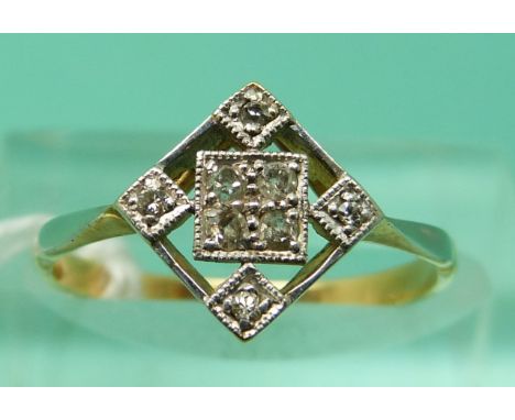 A yellow metal ring set with diamonds in a diamond shaped setting (size K)