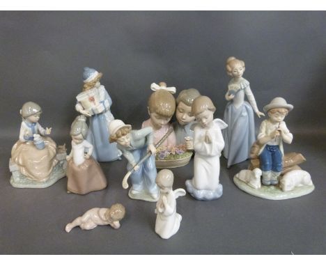 Nao child figures including picking flowers, hockey player, holding presents etc