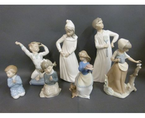 A collection of Nao child figures including girl with butterfly