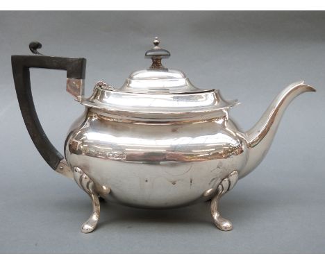 A George V Walker & Hall hallmarked silver teapot raised on four splayed legs, Sheffield 1929, length 28cm, weight 714g