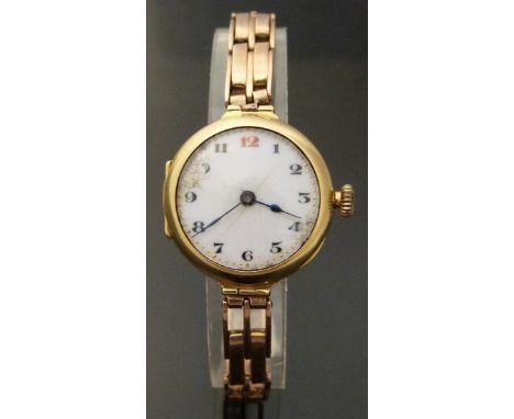 Swiss 18ct gold ladies wristwatch with Arabic numerals, blued hands, gilt minute markers and white enamel dial, on 9ct gold s